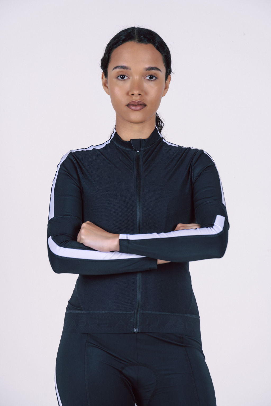 Black-long-sleeve-cycling-jacket- with-white-racing-stripes-on-the- arms-and-a-stand-up-collar