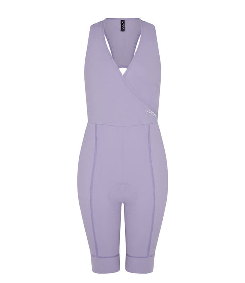Road All-In-One-Lilac-hover-displayed-from-the-front- showcasing-the-unique-surplice-upper-body-The-shorts-have- contoured-stitching-and-a-LUCA-tag-on-the-upper-strap