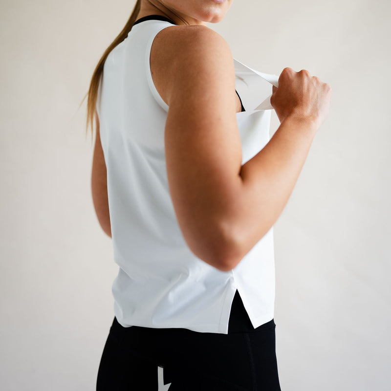 Cyclist wearing LUCA Meander vest in white with cycling shorts, front view