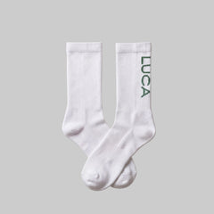 LUCA Traction long cycling socks in matcha colourway, flat lay