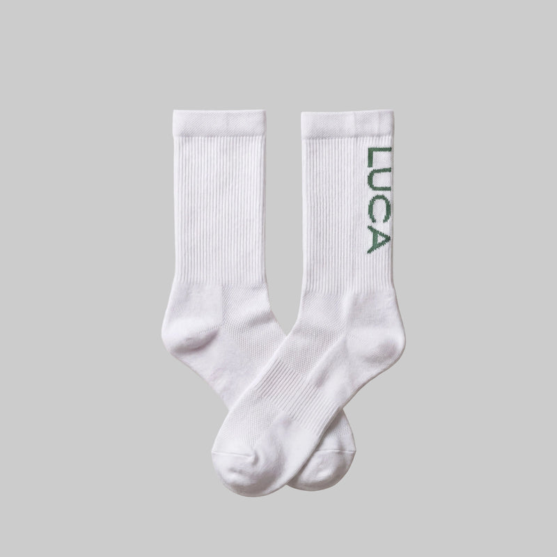 LUCA Traction long cycling socks in matcha colourway, flat lay